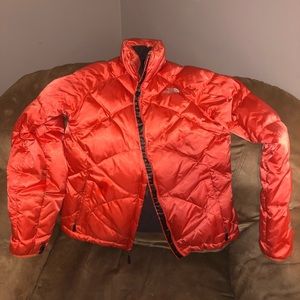 Bright orange north face jacket